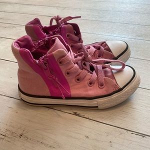 High top, zip converse.